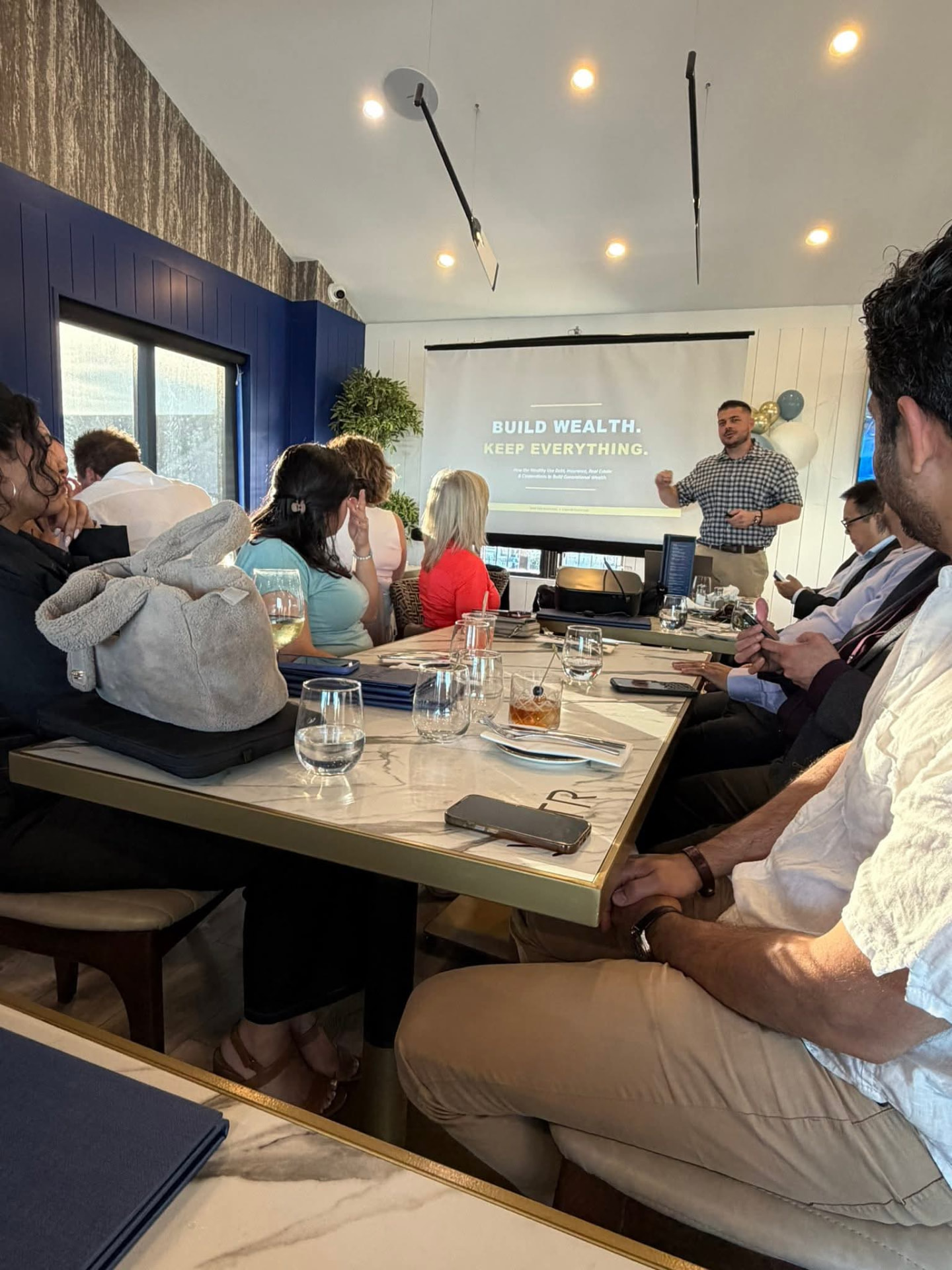 Yiannis speaking at a private dinner event